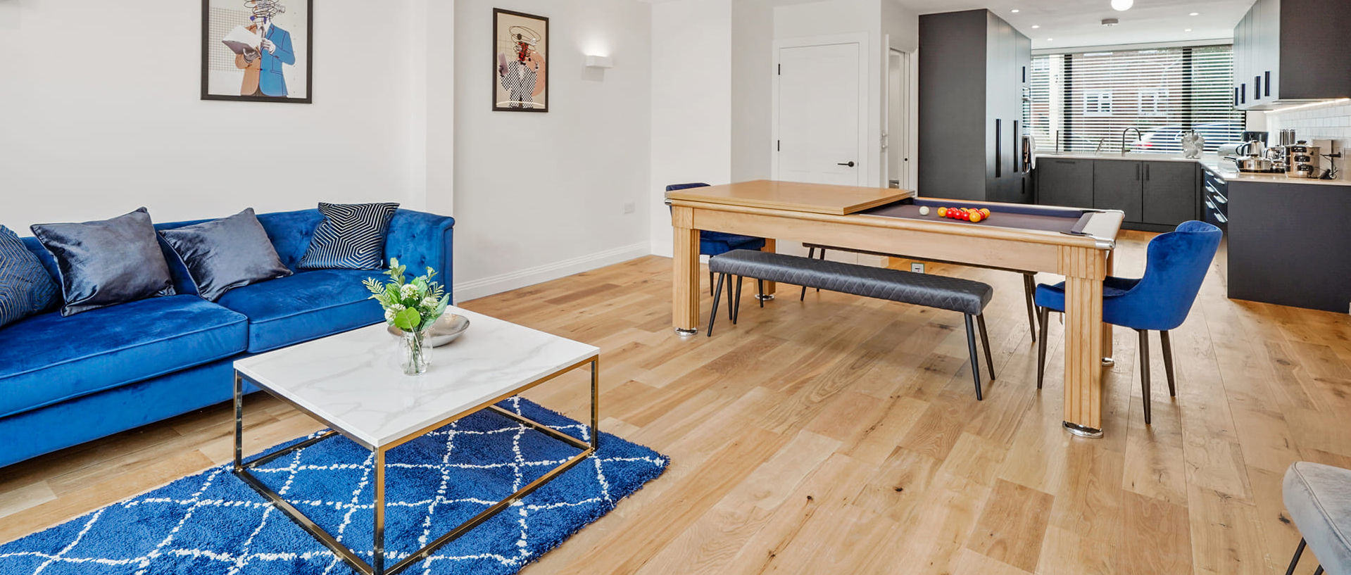 A bedroom furnished with a complete furniture package showing bed, nightstands, and wardrobe